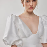 Close-up detail of the Belle dress, showcasing its fine craftsmanship and intricate design.