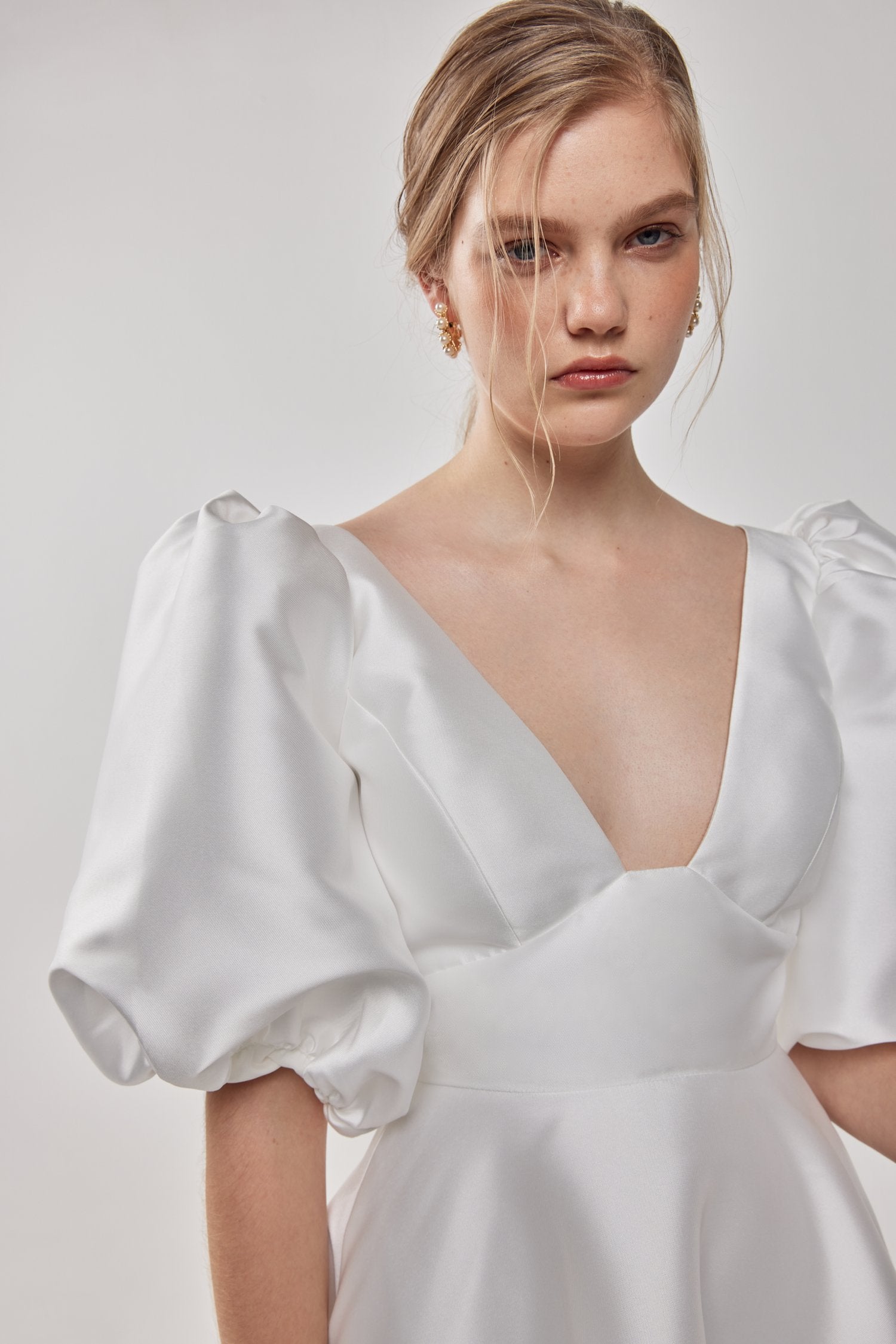 Close-up detail of the Belle dress, showcasing its fine craftsmanship and intricate design.